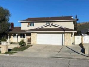 Real estate in Simi Valley: A house with two garages and a driveway.